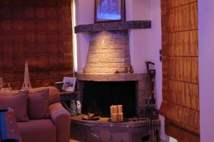 The stone fireplace in the playroom